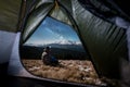 Male hiker have a rest in his camping at night under beautiful night sky full of stars and milky way Royalty Free Stock Photo