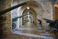 view inside a tunnel with heavy weaponry in the castle of GjirokastÃÂ«r, architecture of the Ottoman empire in Albania.