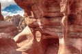 View of interesting rocks carved by time and rains from red sandstone in the canyon. Petra, Jordan. Royalty Free Stock Photo