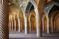 View of the interior architecture of Vakil Mosque with large columns and beautiful decorations and tiles of Iran, Shiraz, Iran.