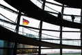 View through the interior of the glass dome at the top of the Reichstag, a historic building which houses the Bundestag, the lower Royalty Free Stock Photo