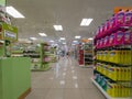 View of the interior of a MÃ¼ller retail store. Shelves on both side of the photo, filled with soap and cosmetic products.
