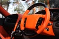 View of the interior of a modern automobile showing the dashboard. Orange car interior Royalty Free Stock Photo