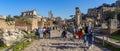 view of the interior ruins of the palatine hill with tourists in circulation, Rome, Italy