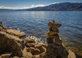 Inushuk standing on a rock in Kelowna Okanagan Lake BC. An inuksuk is a human-made stone landmark