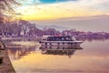 View of Ioannina city and a boat which transfer people to the small island in the the lake Pamvotis. Greece