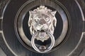 Iron door handle in shape of lion`s head Royalty Free Stock Photo