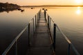 View of the iron pier and sunrise over the lake. Calm and peaceful scene. Long exposure landscape nature photography Royalty Free Stock Photo