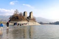 View of the island of Ogoz, Ile d'Ogoz, on Lake Gruyere in Switzerland. There are the ruins of a castle and a