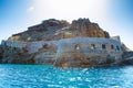 View of the island of Spinalonga with calm sea. Here were isolated lepers, humans with the Hansen`s desease, gulf of Elounda.