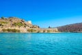 View of the island of Spinalonga with calm sea. Here were lepers, humans with the Hansen`s desease, gulf of Elounda.