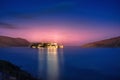 View of the island of Spinalonga at night with nice clouds and calm sea. Here were isolated lepers.