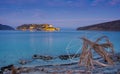 View of the island of Spinalonga at night with nice clouds and calm sea. Here were lepers.