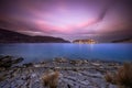 View of the island of Spinalonga at sunset with nice clouds and calm sea.