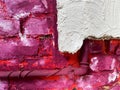 View on isolated rough brick wall painted in white, pink, purple and white color with water pipe Focus on white wall right Royalty Free Stock Photo