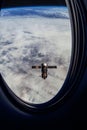 View on ISS Progress resupply ship, View out from a passenger window on the SpaceX Crew Dragon. Docking maneuver near