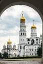 View of Ivan the Great Bell Tower of the Moscow Kremlin through the arch of the gate of the Spasskaya Tower Royalty Free Stock Photo