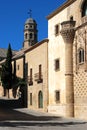 View of Jabalquinto Palace with the cathedral bell tower to the rear, Baeza, Spain. Royalty Free Stock Photo