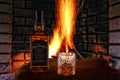 View of JACK DANIELS TENNESSEE WHISKEY in a bottle and a glass of WHISKEY