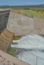 The view of Jackson Dam. The Snake River is flowing out of the dam in the Grand Teton National Park, Wyoming Royalty Free Stock Photo