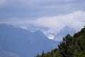 View of the Jade Dragon Snow Mountain in the clouds from Jade Spring Park, Lijiang Royalty Free Stock Photo