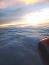 View of Jet engine and Clouds or sunset from inside the plane. Royalty Free Stock Photo