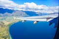 View from a jet plane window high on the blue skies Royalty Free Stock Photo