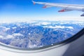 View from a jet plane window high on the blue skies Royalty Free Stock Photo