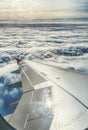 View of jet plane wing above the clouds Royalty Free Stock Photo