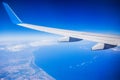 View of jet plane wing with blue sky Royalty Free Stock Photo