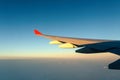 View of jet plane wing with cloud patterns Royalty Free Stock Photo