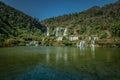 View of the Jiulong waterfall streaming down to a lake