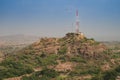 View of Jodhpur city mobile tower beside Mehrangarh fort, jodhpur, Rajasthan, India. Blue sky in the background. History meets Royalty Free Stock Photo