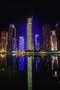 View of Jumeirah Lakes Towers skyscrapers at night.