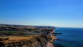 View of the Jurassic coast from a drone against the background of the blue sky. England, UK. Royalty Free Stock Photo