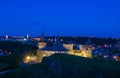 View on the Kamianets-Podilskyi ?astle in the evening. Beautiful stone castle on the hill on the sunset. Clouds in the darkening Royalty Free Stock Photo