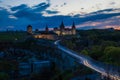 View on the Kamianets-Podilskyi ÃÂastle in the evening. Beautiful stone castle on the hill on the sunset. Clouds in the darkening Royalty Free Stock Photo