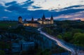 View on the Kamianets-Podilskyi ?astle in the evening. Beautiful stone castle on the hill on the sunset. Clouds in the darkening Royalty Free Stock Photo