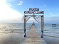 View of Karang Ginger beach, Central Java with a wooden bridge and hut in the middle with a clear sky in the background Royalty Free Stock Photo