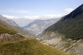 View of the Karmadon gorge with traces and remnants of the descended glacier Royalty Free Stock Photo