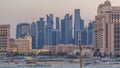 View from Katara Beach day to night timelapse in Doha, Qatar, towards the West Bay and city center Royalty Free Stock Photo