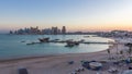 View from Katara Beach day to night timelapse in Doha, Qatar, towards the West Bay and city center Royalty Free Stock Photo