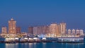 View from Katara Beach day to night timelapse in Doha, Qatar, towards the Pearl