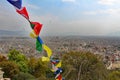 View of Kathmandu from a temple with prayer flags Royalty Free Stock Photo