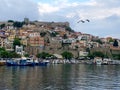 View of Kavala Fortress and town hiuses in the daylight with a seagull