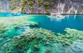 View of Kayangan Lake lagoon with tourists boat and coral reef