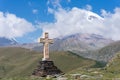 View of Kazbeg mountain and a cross, by the trinity church, Georgia