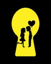 View through the keyhole. Silhouette of a girl and a boy. upcoming kiss. Romantic couple.