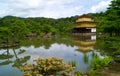 View of Kinkaku-Ji in front of a lake among the beautiful nature in Kyoto, Japan