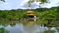 View of Kinkaku-Ji in front of a lake among the beautiful nature in Kyoto, Japan